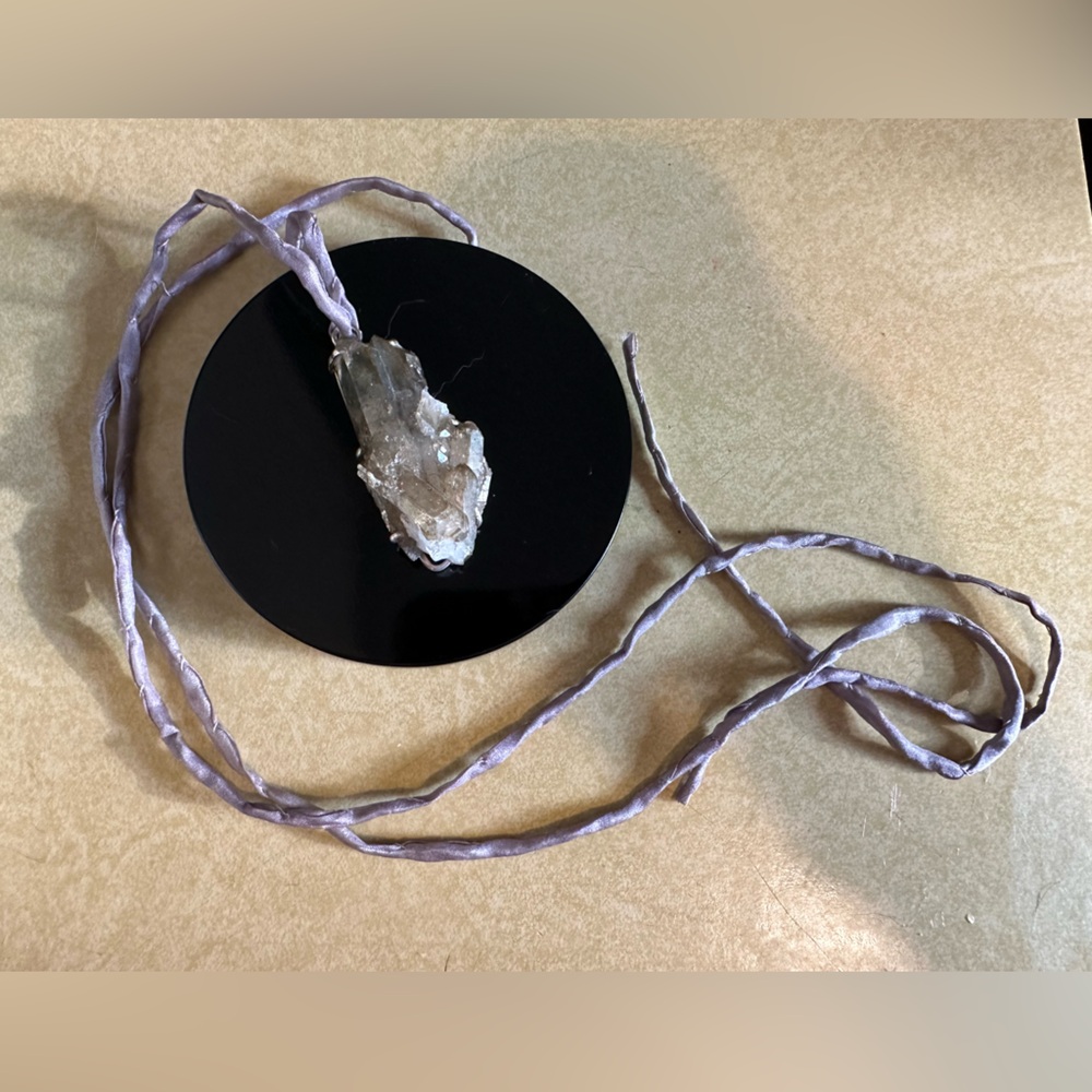 Aura Multi Point Sterling Silver Pendant on light purple silk cord.